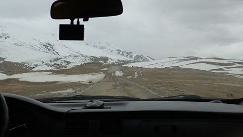 View of car on snow covered landscape