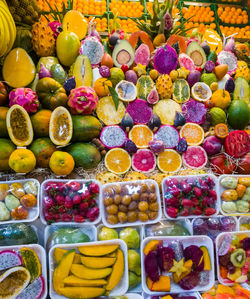 High angle view of multi colored fruits for sale in market