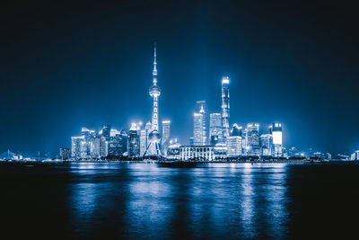 Illuminated buildings in city at night
