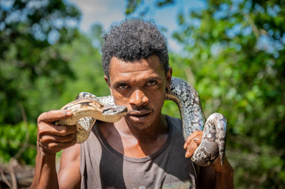 Malagasy guy with boa