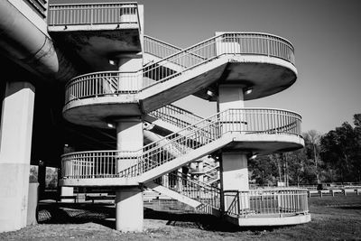 Low angle view of boy against built structure