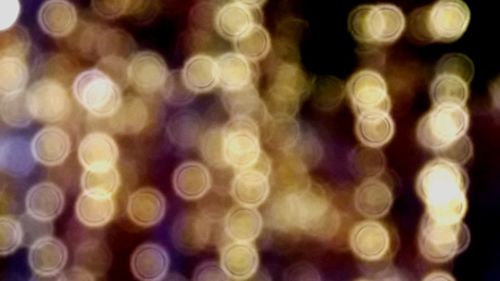 Defocused image of illuminated lights at night