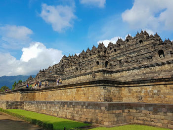 View of temple against cloudy sky