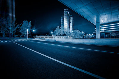 High angle view of light trails on road in city at night