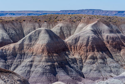 Landscape of purple and brown badlands at blue mesa in petrified forest national park in arizona