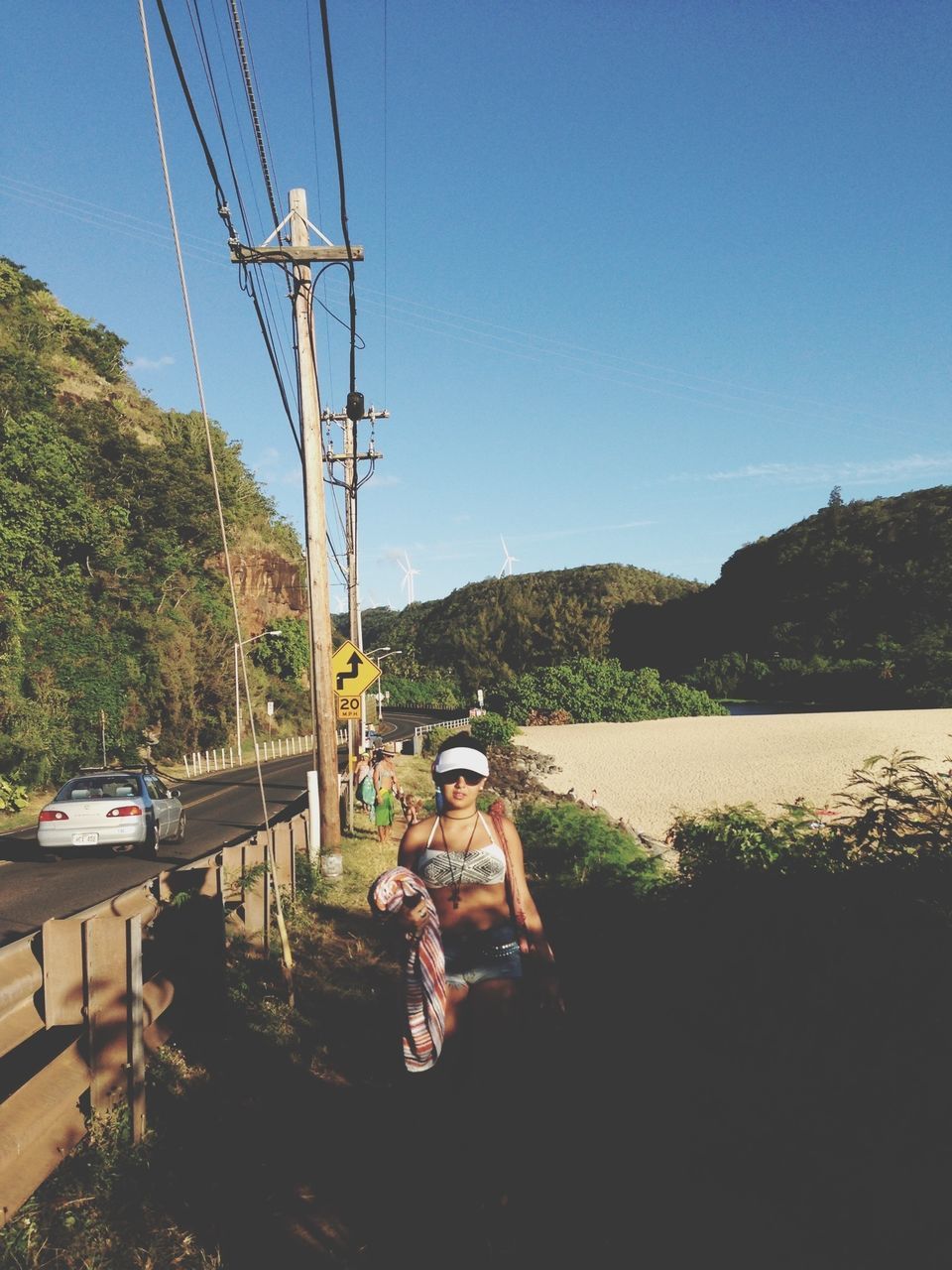 transportation, clear sky, mode of transport, electricity pylon, power line, mountain, tree, sky, electricity, nautical vessel, technology, blue, fuel and power generation, power supply, nature, day, sunlight, water, travel, landscape