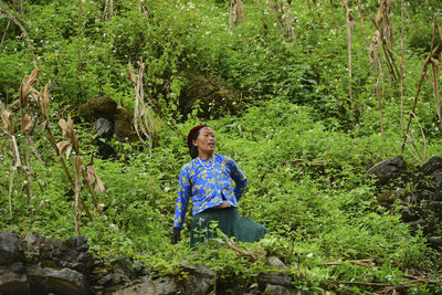 Full length of woman in forest