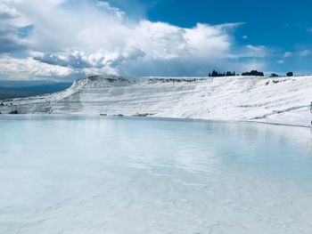 Scenic view of frozen sea against sky