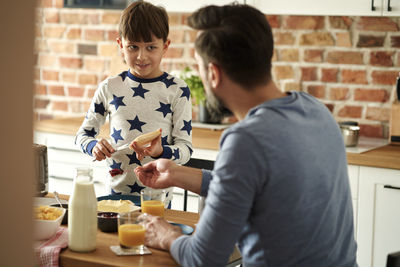 Portrait of boy playing with toy on table