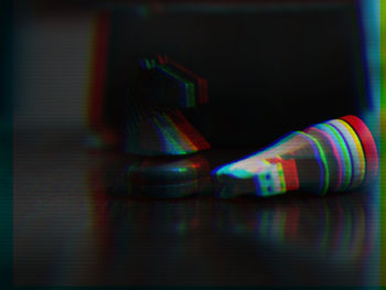 Close-up of illuminated lighting equipment on table