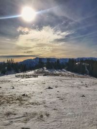 Scenic view of land against sky during winter