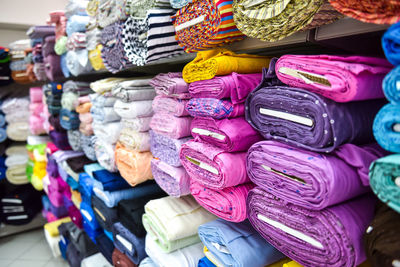 Various colorful textiles displayed for sale in store