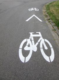 High angle view of bicycle sign on road