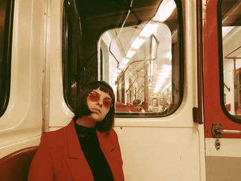 Portrait of woman sitting in train