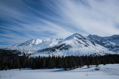 Scenic view of snowcapped mountains against sky