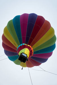 Low angle view of hot air balloons against clear sky