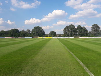 Scenic view of soccer field against sky