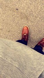 Close-up of shoes on tiled floor