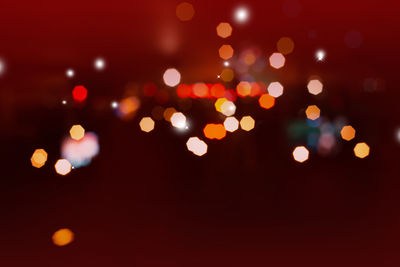 Defocused image of illuminated lights at night