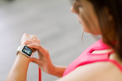 Close-up of young woman using mobile phone