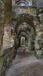 Rear view of woman in historic building