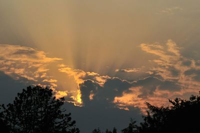 Low angle view of cloudy sky at sunset