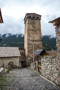 View of old building against cloudy sky