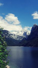 Scenic view of mountains against cloudy sky