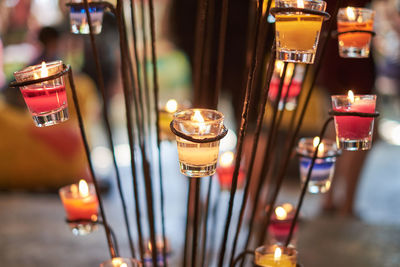 Close-up of illuminated tea lights