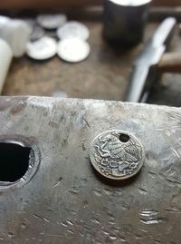 High angle view of coins on table