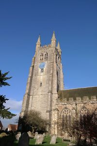 Low angle view of church against clear blue sky