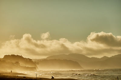 Panoramic view of sea against sky during sunset