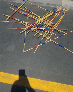 High angle view of yellow umbrella on road