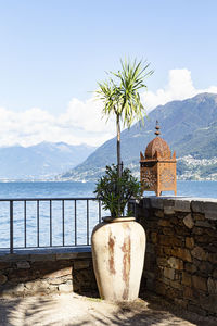 Switzerland, ascona, 1 sept 20. idyllic lookout on the isle of brissago with vase and lantern