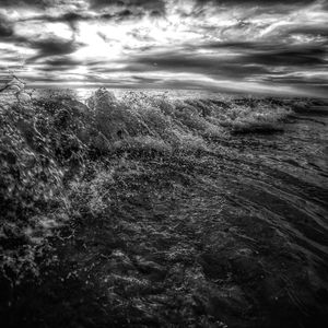 Scenic view of landscape against cloudy sky