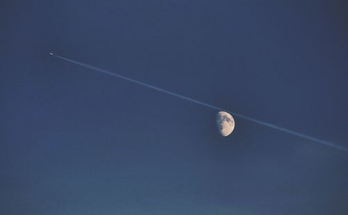 Low angle view of vapor trails in sky