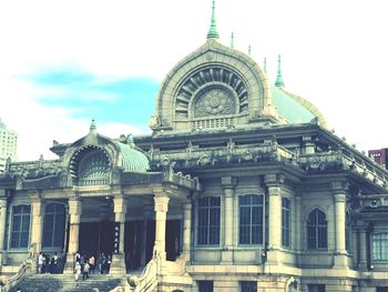 Facade of historic building against sky