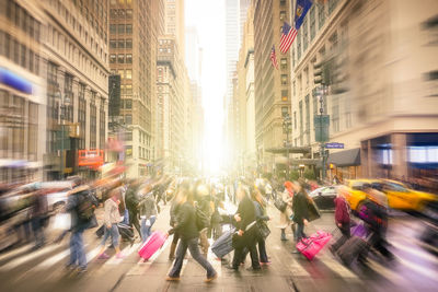 Group of people walking on city street