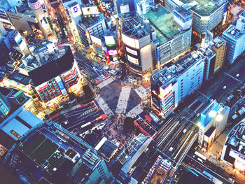 High angle view of illuminated buildings in city