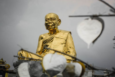 Low angle view of statue against sky