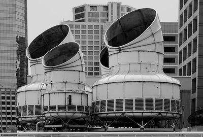 Cooling towers against office buildings in city