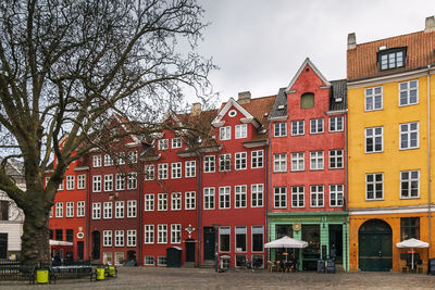 Residential buildings against sky in city