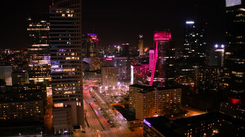 High angle view of illuminated buildings in city at night