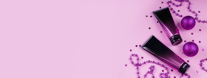 High angle view of beauty products on pink background