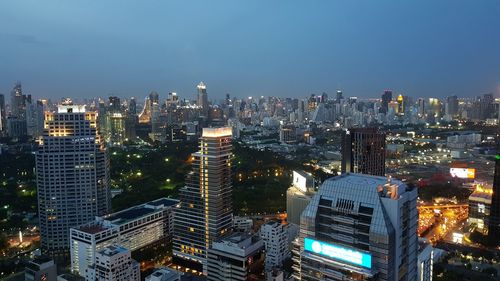 High angle view of illuminated buildings in city against sky