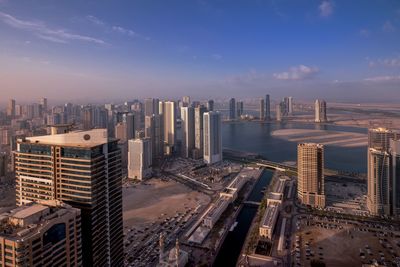 High angle view of buildings in city against sky