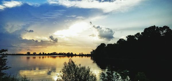 Scenic view of lake against sky during sunset