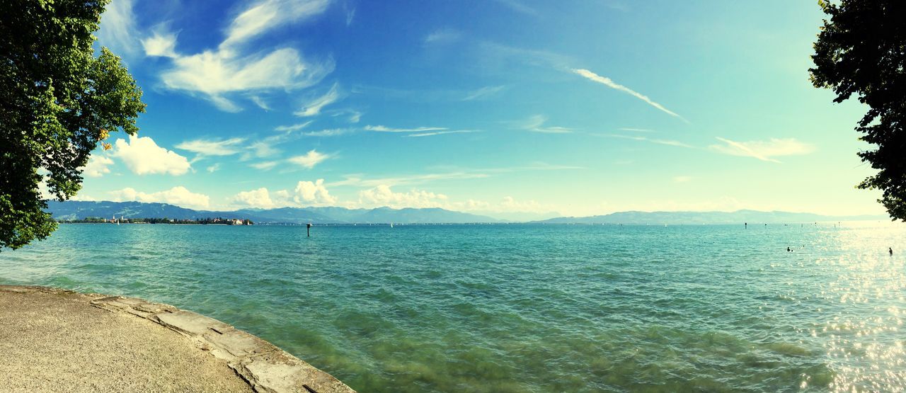 water, sky, tranquil scene, tranquility, tree, scenics, beauty in nature, blue, sea, nature, cloud, cloud - sky, nautical vessel, rippled, idyllic, mountain, lake, day, sunlight, outdoors