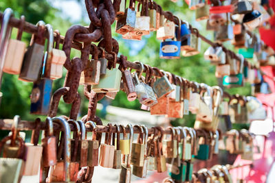 Close-up of padlocks hanging on metal