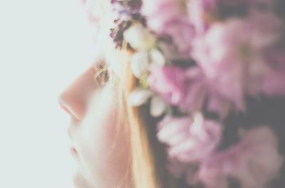 Close-up of woman wearing flowers wreath